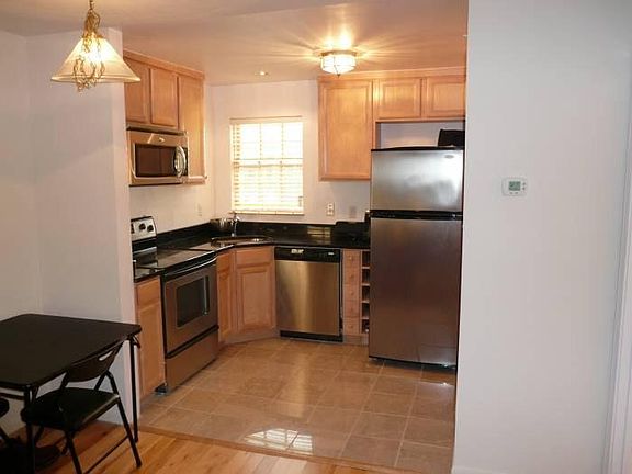 Full kitchen with stainless appliances.