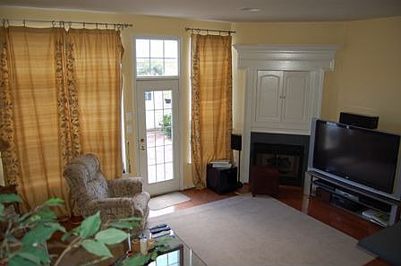 Family room with hardwood floor and fireplace