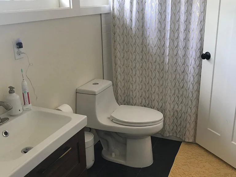 Upper level bathroom with heated towel rail and double sink