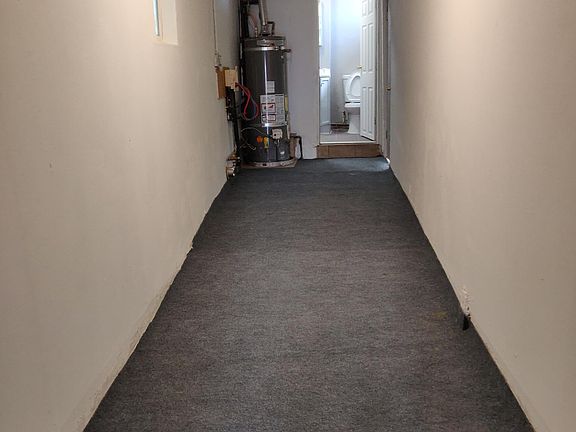 Hallway to laundry and restroom