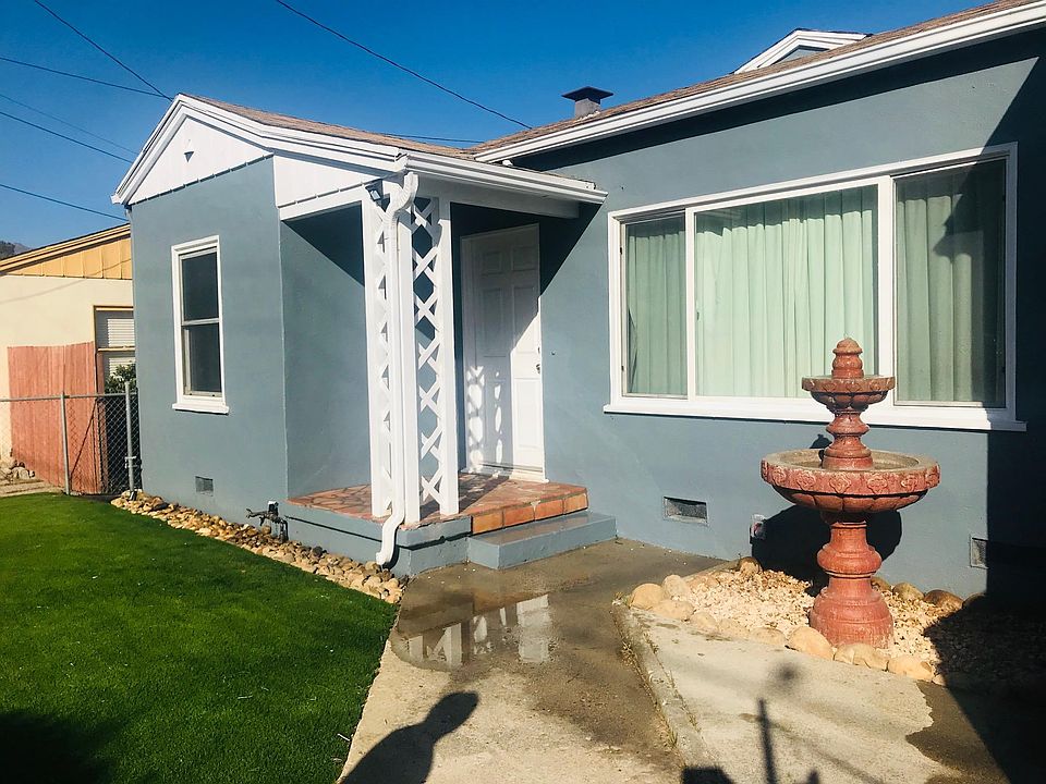 Large front yard offering space to relax, garden, or enjoy the outdoors