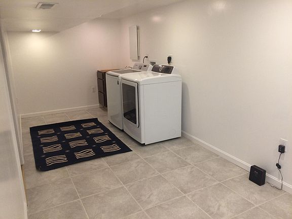 Laundry room includes washer, dryer and sink for tenant use only