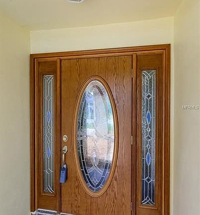 Stunning Covered Front Porch, Beautiful Entry Door & Sidelights - Includes Hurricane Shutter Too!