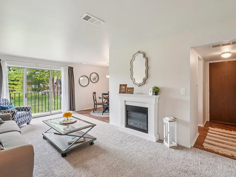 Elevated living room and private patio or balcony at Drawbridge Apartments in Harrison Township, MI.