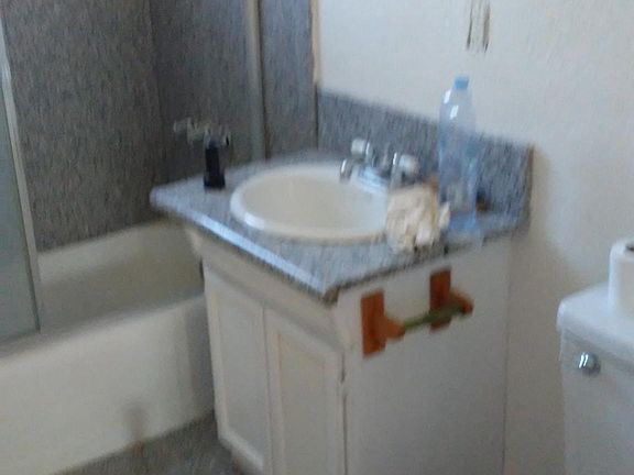 unit C bathroom granite shower floor and counter top