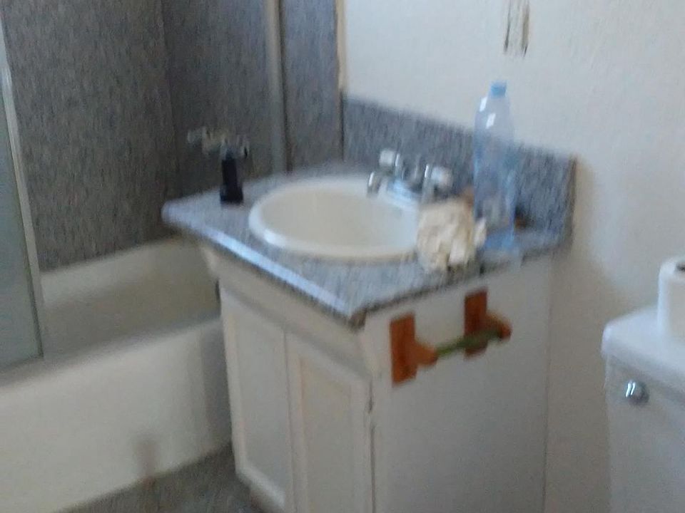 unit C bathroom granite shower floor and counter top