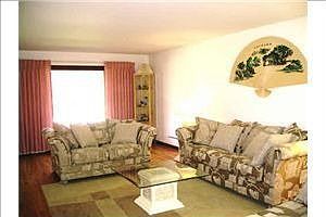 Large and bright living room with beautiful oak floor