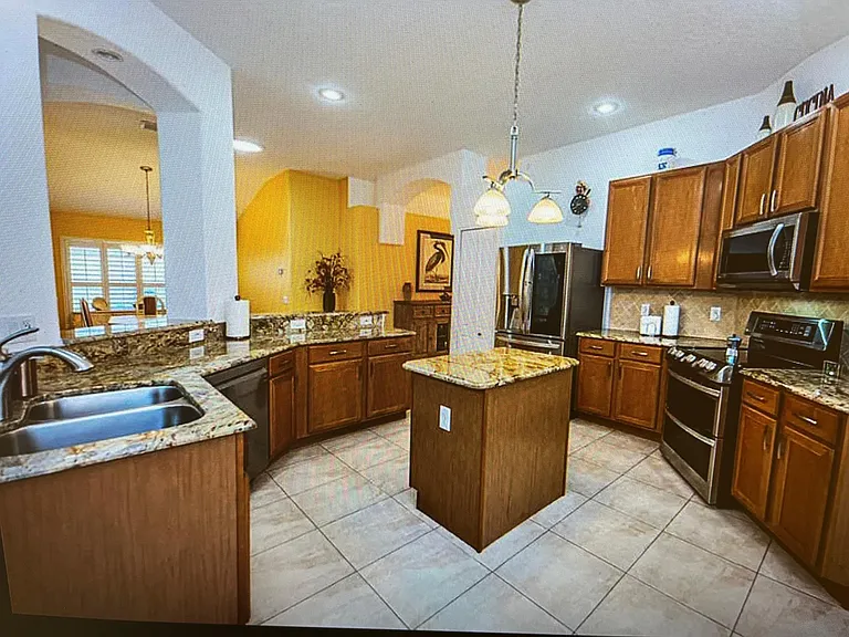 Spacious kitchen overlooking family room