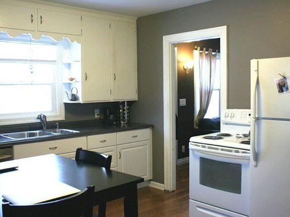 Kitchen has new appliances and updated colors while keeping the old-growth hardwood floor