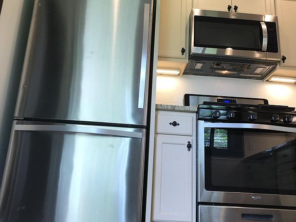 New stainless appliances. Refrigerator, gas range, microwave and dishwasher.