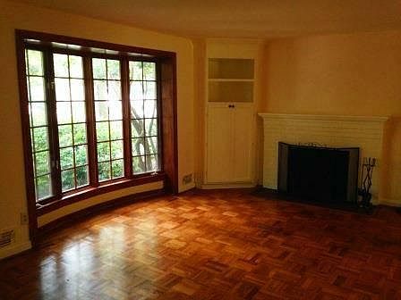 Living room with wood burning fireplace