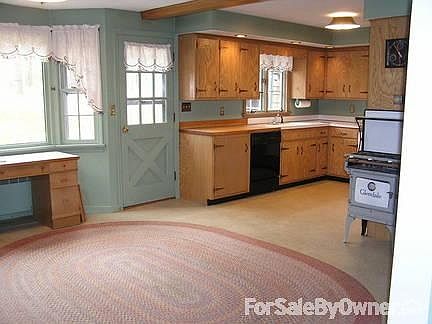 VIEW OF KITCHEN FROM DINING AREA