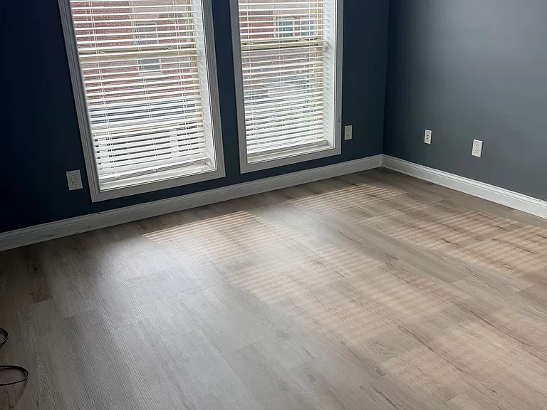 Bedroom#2 with new blinds, new LVP flooring, and ceiling fan. 
High ceiling and large windows for natural lights.
