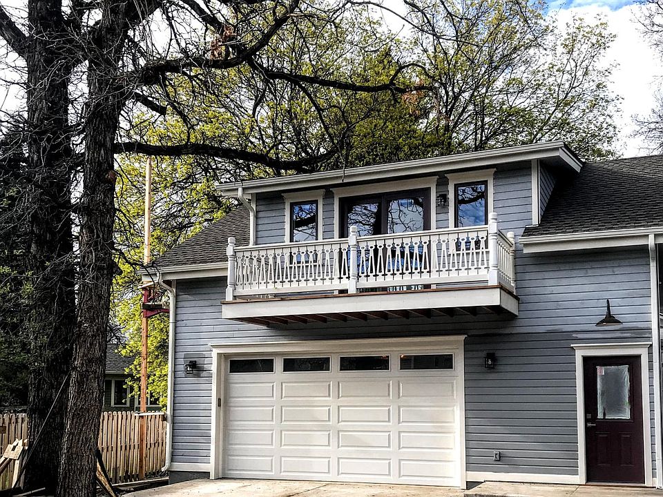 Behind house above garage. This is the main entrance.