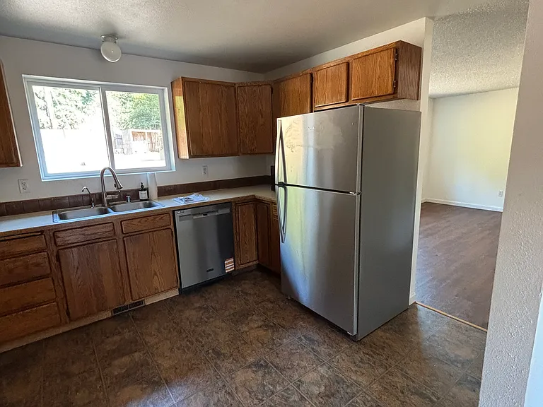NEW STAINLESS STEEL FRIDGE AND DISHWASHER