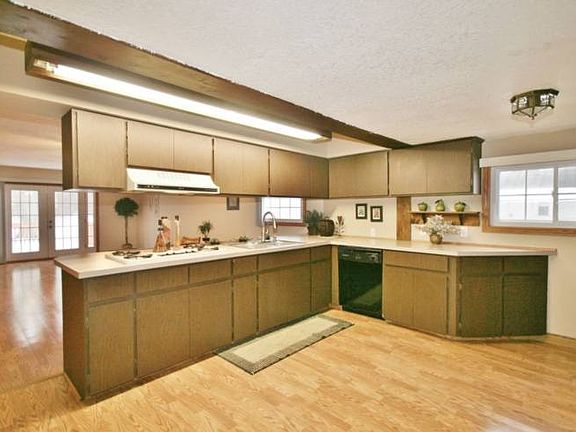 There will be no cry for shortage of cabinet and counter space. This picture is just half of what this home has to offer. Newer floors in the kitchen for easy clean ups.