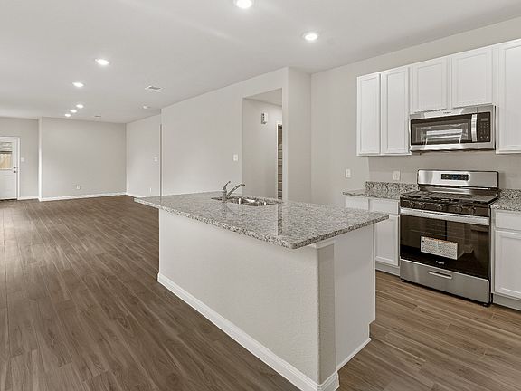 Dining Area and Kitchen to Family Room