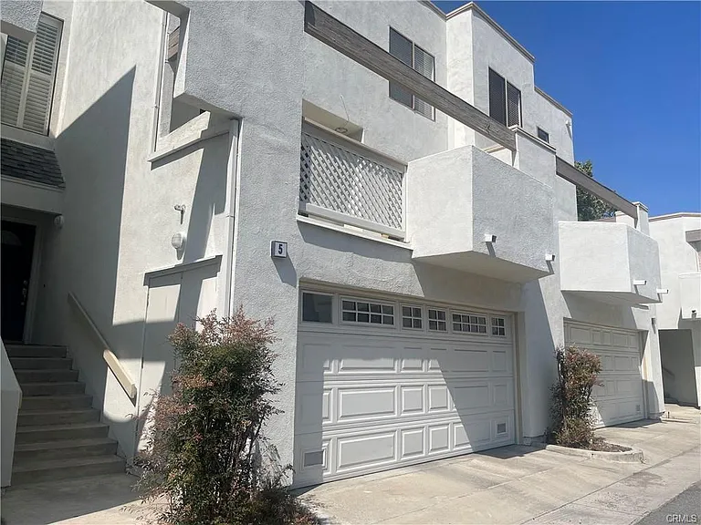 front of the condo has a staircase