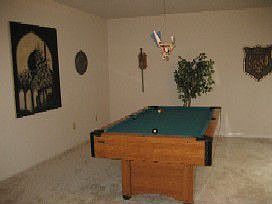 Formal living room off entry makes for a great gameroom or study