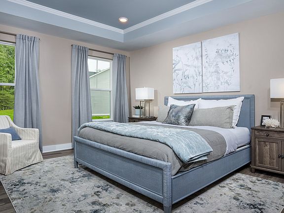 Sunlit Owner s Room on the Main Level with a Walk-in Closet and Private Bathroom