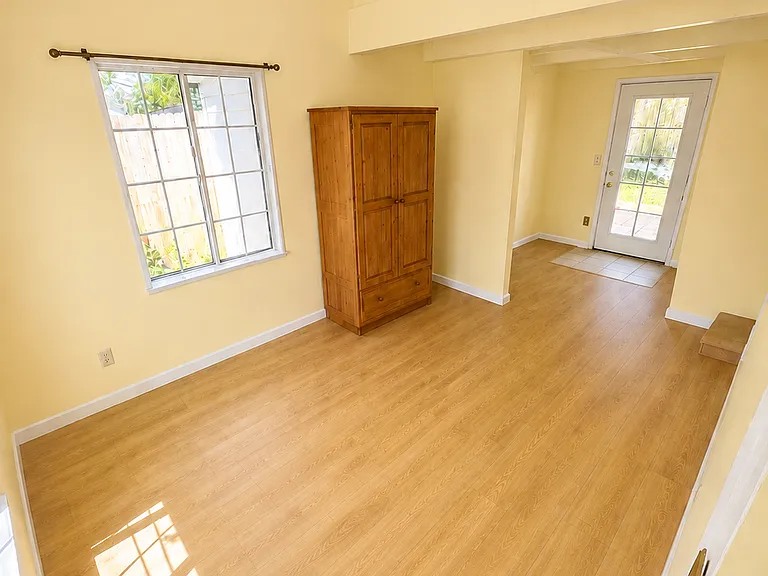 Main level bedroom with French door access to the yard _ renovation rendering
