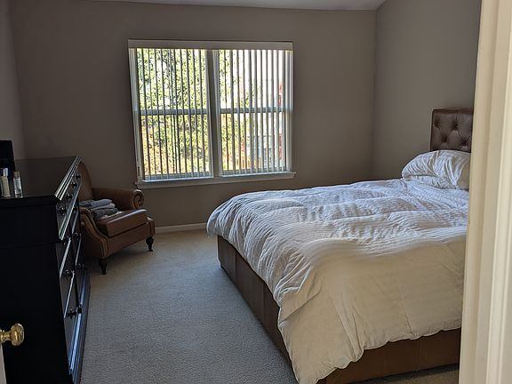 Master bedroom with vaulted ceiling and his/her walk-in closet