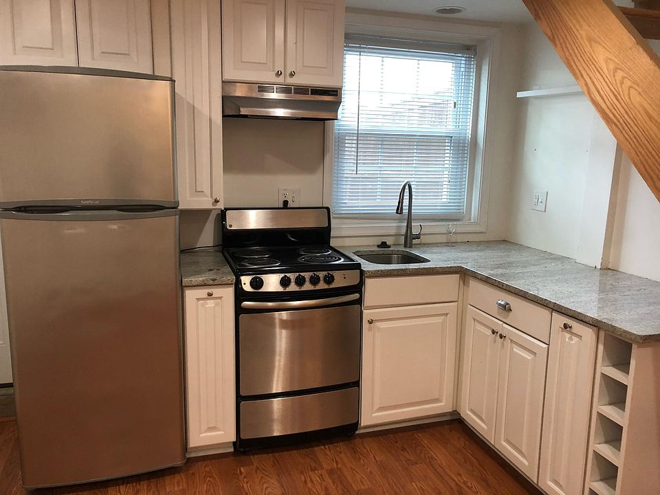 Bright and sunny kitchen on first floor of carriage house.