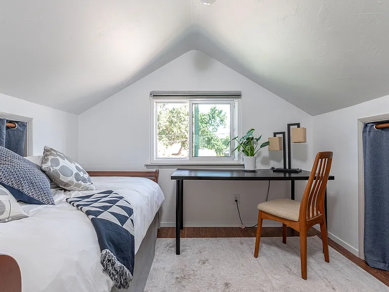 Currently setup as a walk in closet, this half bedroom has been used in the past as a guest bed and office.