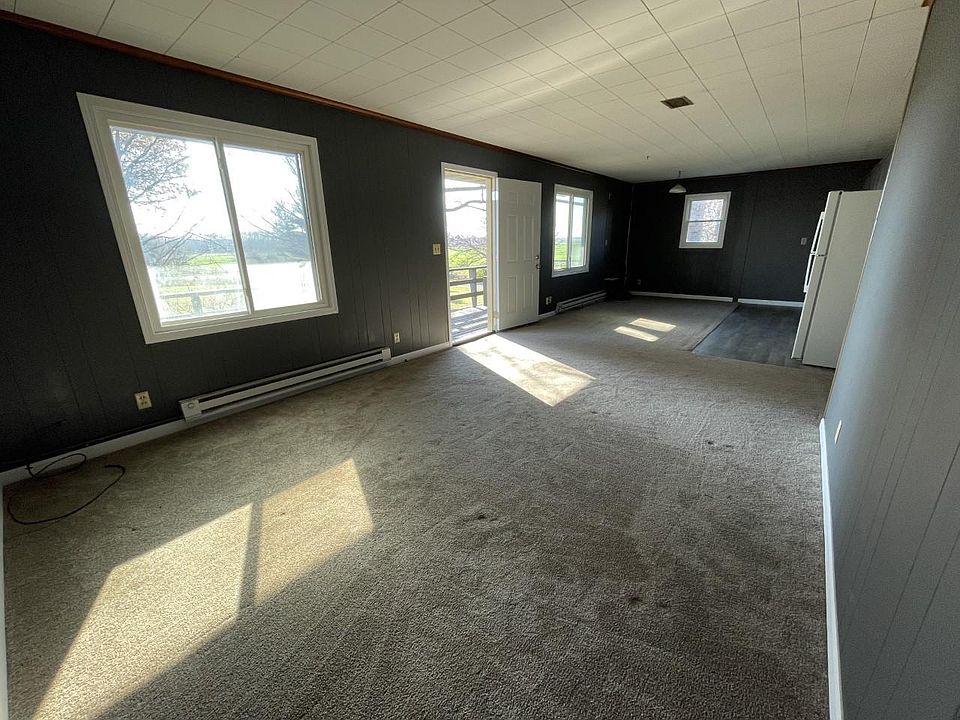 Living room with back door leading to the porch