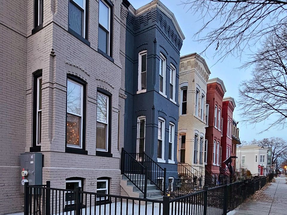 Neighborhood view. Unit located in the lower level of far left gray building.