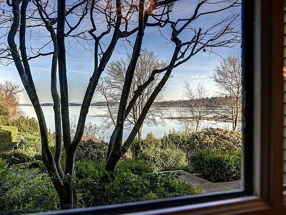 North view to Bellevue and floating bridges over Lake Washington from dining area.