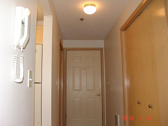 Entering unit/front door intercom to left