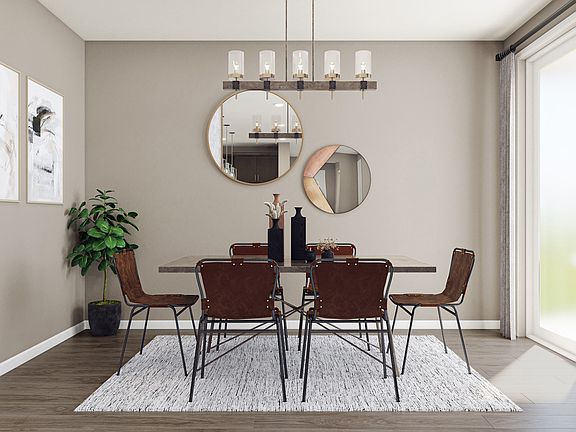 Dining Room with Laminate Wood Flooring and Sliders to Covered Patio
