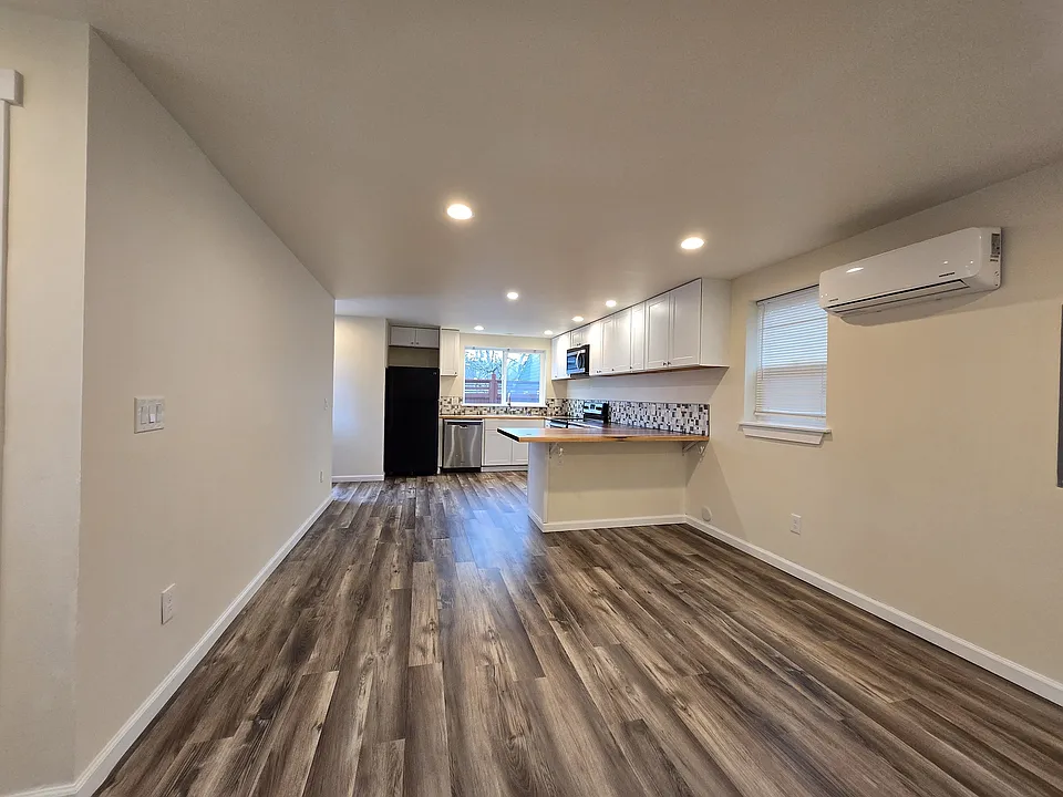 So much room here. Eat-in bar. Ductless heat pumps throughout for heating and cooling!