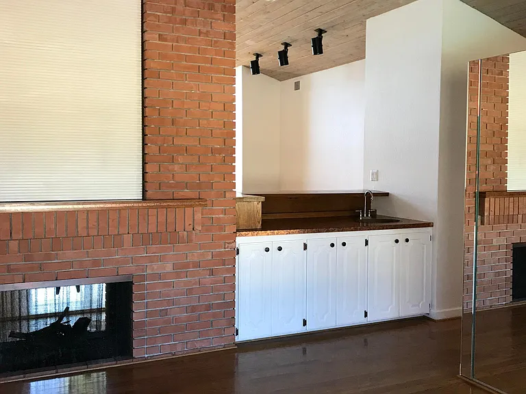 Fireplace from dining room side and wet bar