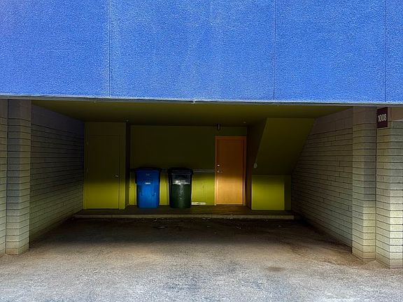 Private carport, with trash and recycle bins for use of 1008 unit.