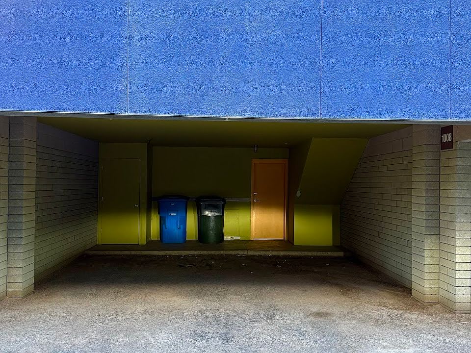 Private carport, with trash and recycle bins for use of 1008 unit.