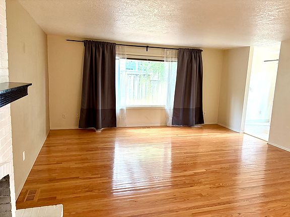 Directly back from the front hallway is a large living room. Living room has gas fireplace. It connects with dining nook and kitchen.