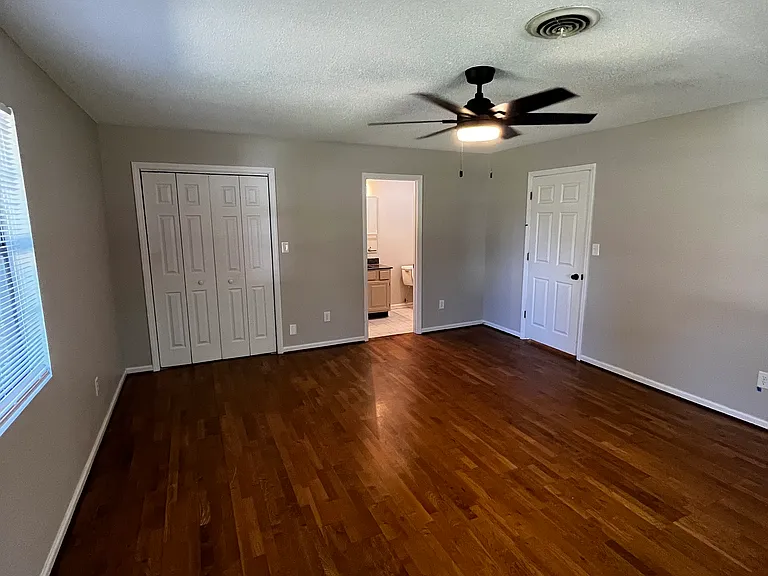 first bedroom with an en suite 1/2 bath