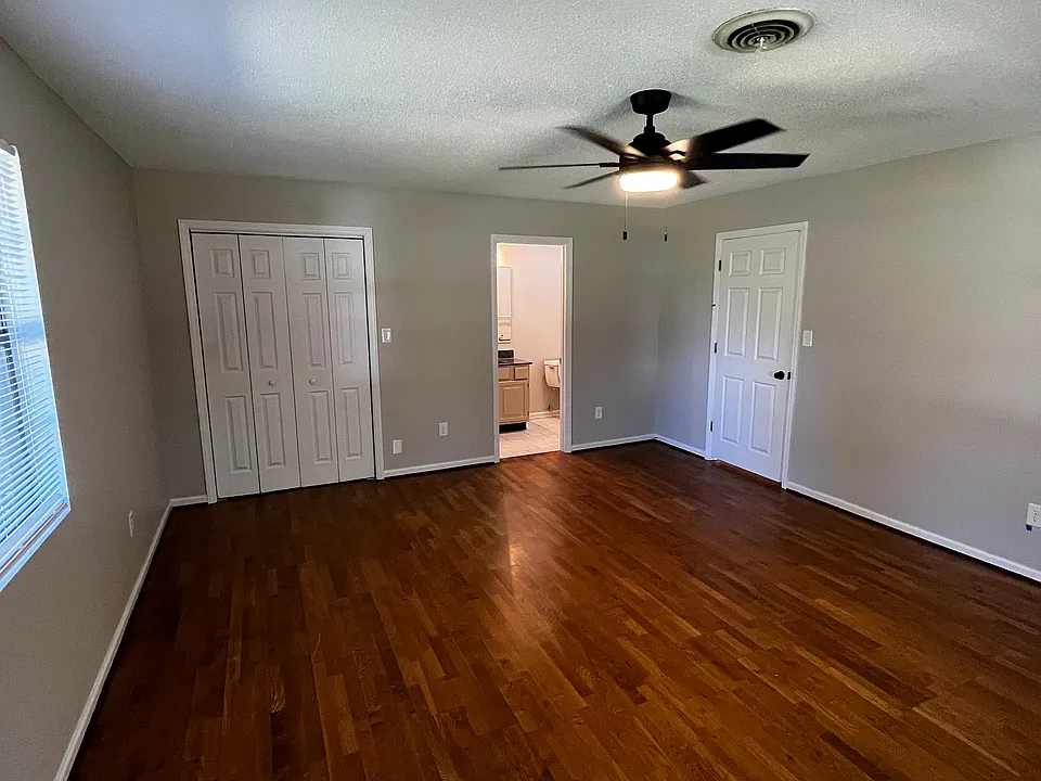 first bedroom with an en suite 1/2 bath