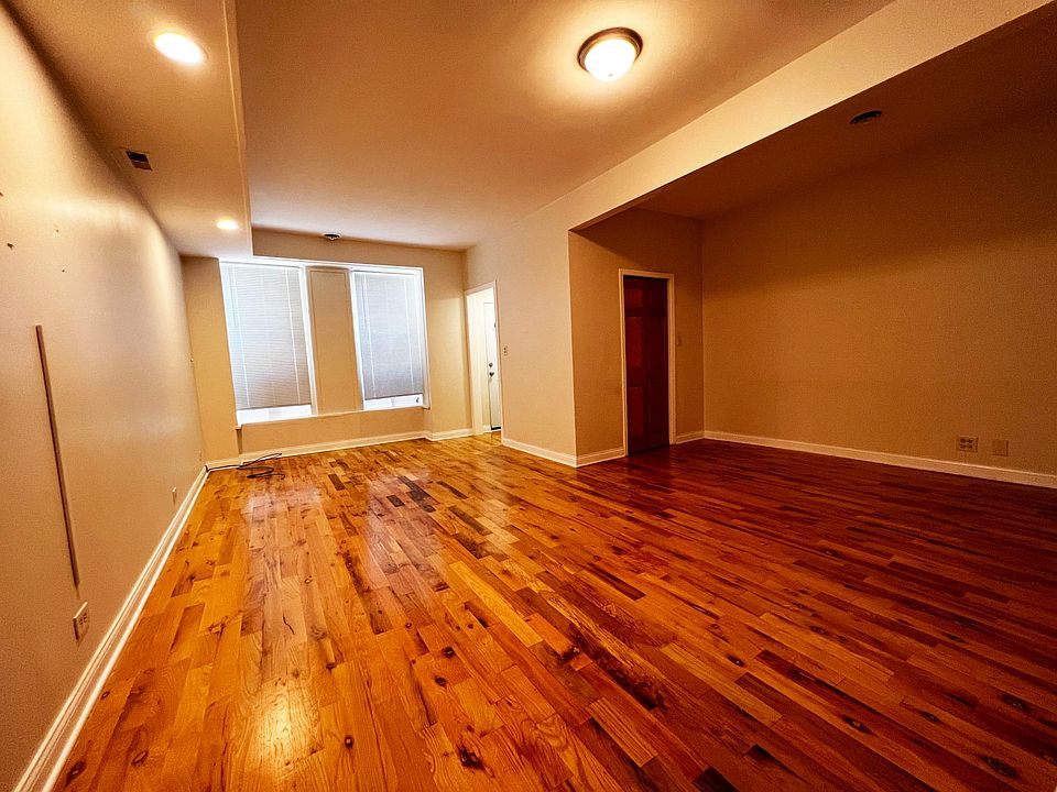 Large living room area with huge closet and front entrance