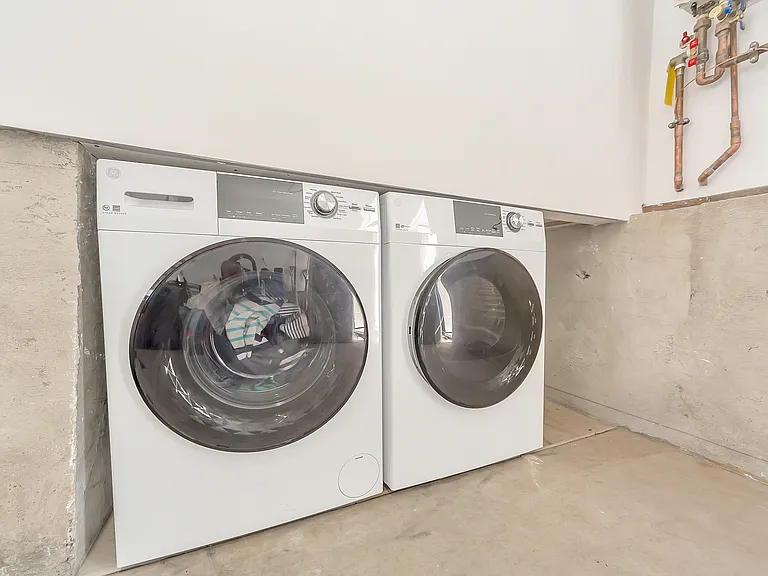 Washer and dryer are included and conveniently located in the garage. Garage has direct access to the downstairs.