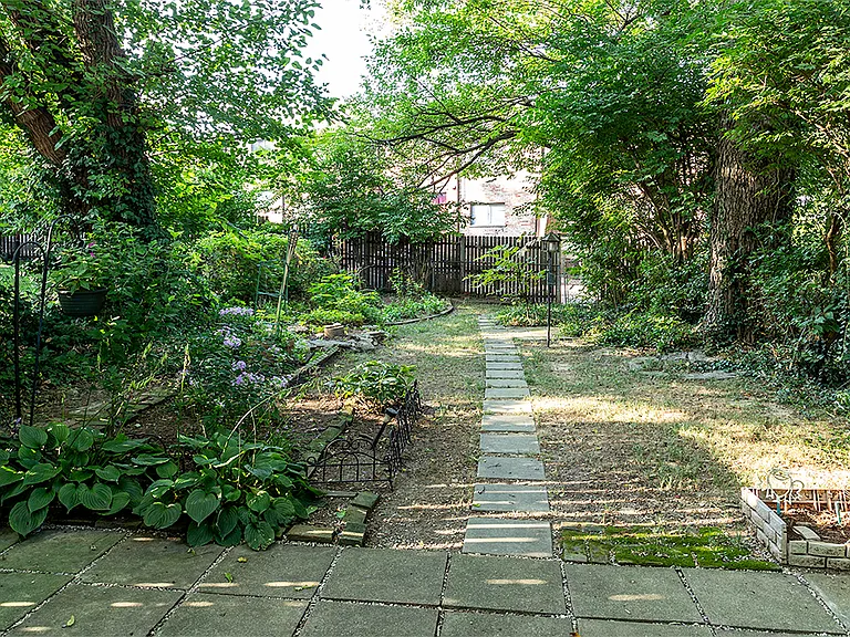Walkout from kitchen to lovely rear yard maintained by Landlord.