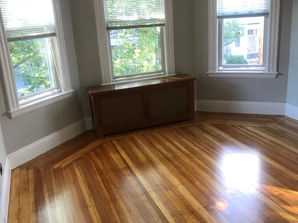 living room with new hardwood floors tree shade in the front of the house