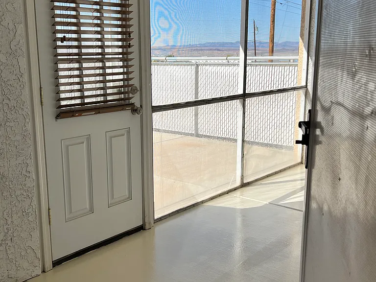 Door in the Arizona room to outside patio