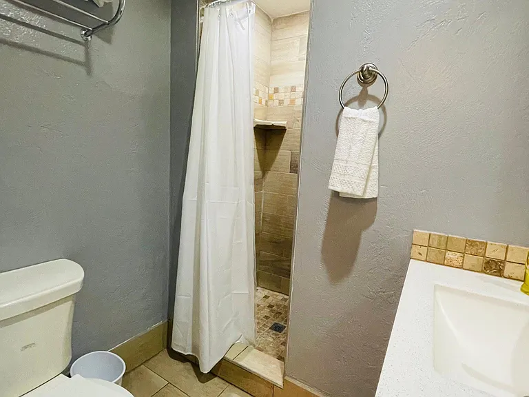 Bathroom with towels and hairdryer