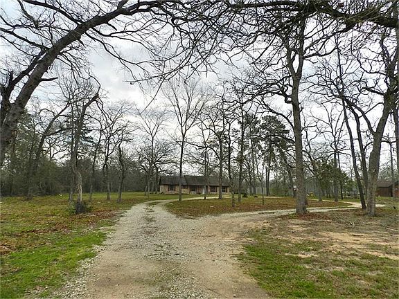 Circular driveway and over an acre! Newly installed front cedar fence with gate.
