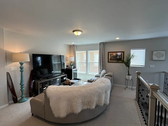 Loft living space with large sectional. TV is not included.