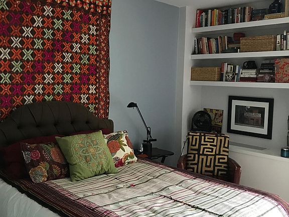 Bedroom with built-in shelves; large closet; plenty of room for chest of drawers; window