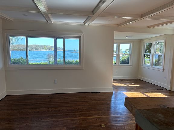 Living Room with Window Overlooking Water